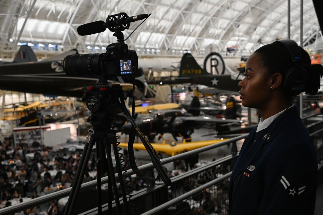 Woman standing in front of camera.