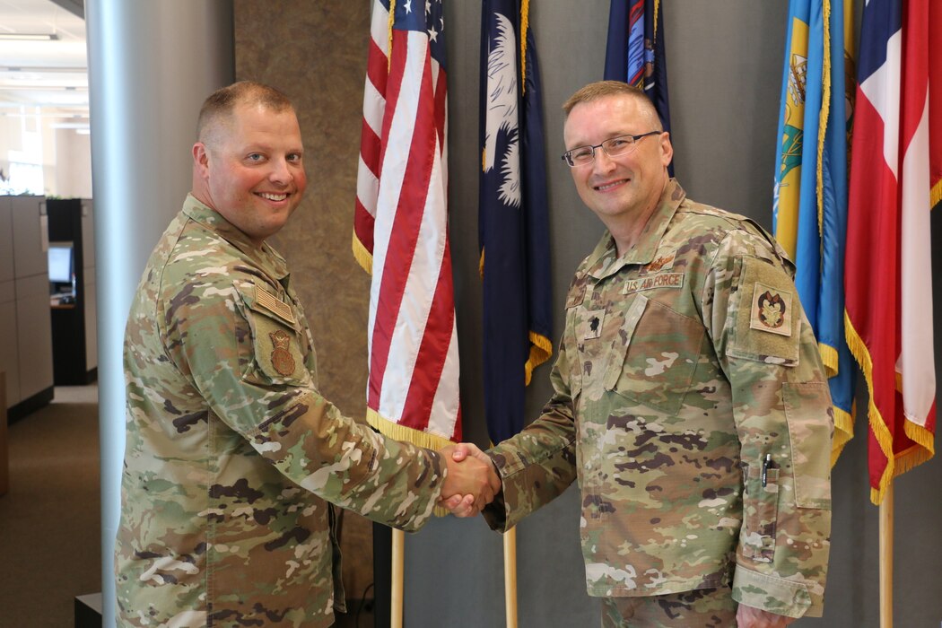 Aikins reenlists