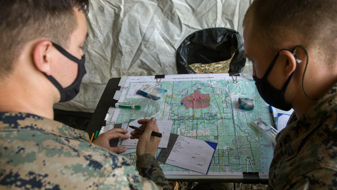 U.S. Marine Corps Sgt. William Weisberg, right, a Fire Control Team Chief, works with Sgt. Anthoney Bouta, a Forward Observer, both with 6th ANGLICO, Joint Base Lewis-McChord, Wash., USMC Reserve, on coordinating close air support training missions during Northern Strike 20, Camp Grayling, Michigan, July 21, 2020. Northern Strike is designed to challenge participants in an All-Domain training environment with multiple forms of convergence that advance interoperability across multicomponent, multinational, and interagency partners. (U.S. Army photo by Sgt. Adam Parent)