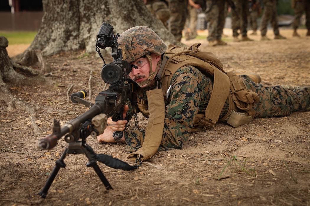 U.S. Marine Corps Lance Cpl. Jonathan N. Traynor Jr., a student with 4th Marine Division, holds security during a rehearsal for a simulated raid in Poplarville, Mississippi, June 4, 2023. Exercise Raven is Marine Forces Special Operations Command’s pre-deployment exercise designed to evaluate the readiness of MARSOC companies and teams. To assist this mission, Marine Forces Reserve regularly collaborates with MARSOC to integrate specific Reserve force capabilities like civil affairs, law enforcement, cyber, intelligence, and Air Naval Gunfire Liaison Company (ANGLICO) into MARSOC training, exercises and operational deployments. This collaboration strengthens Reserve force capabilities and informs MARSOC's efforts to enhance and operationalize their Individual Mobilization Augmentee (IMA) Detachment to retain and employ Reserve Marines with these critical skill sets. (U.S. Marine Corps photo by Lance Cpl. David Brandes)