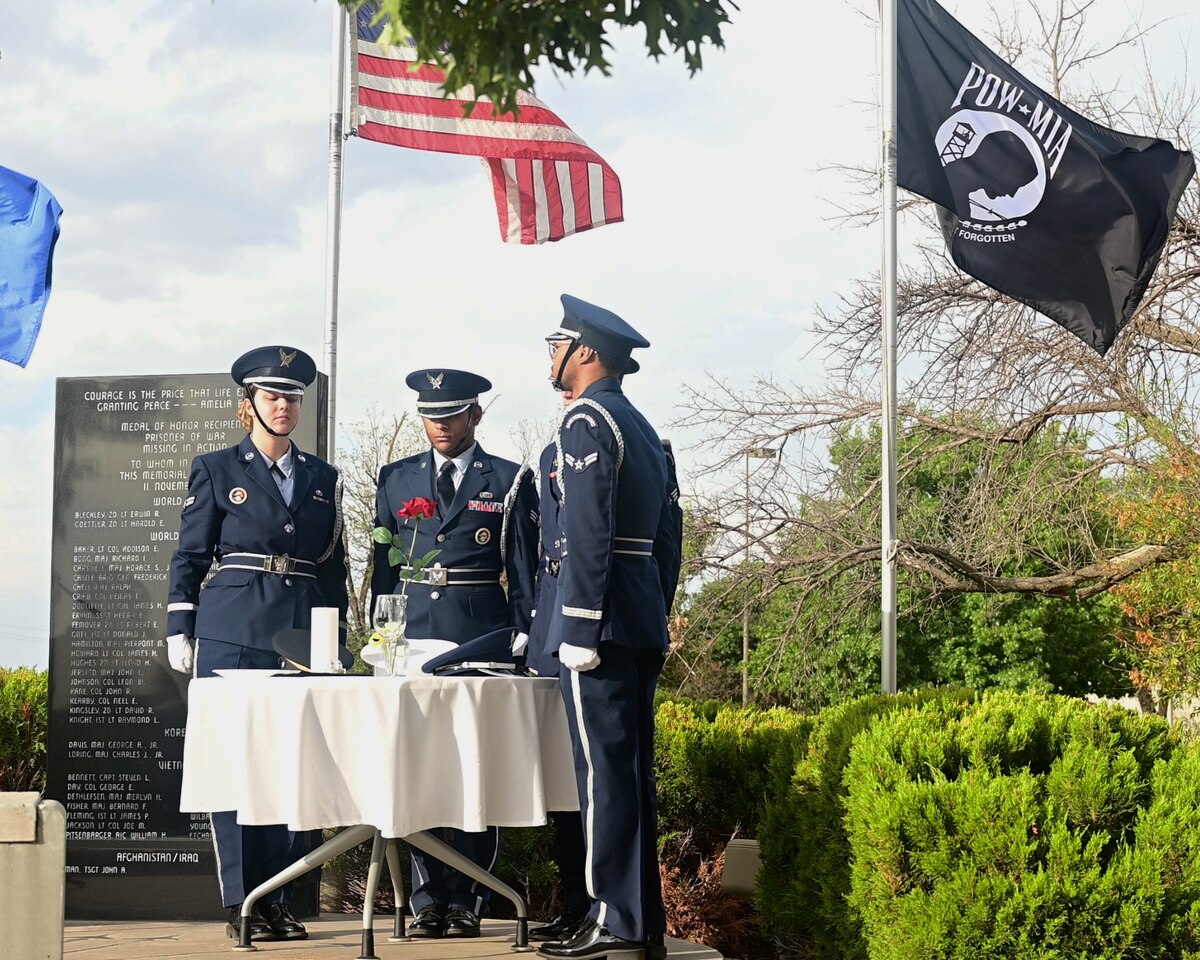 17th Training Wing base honor guardsmen conduct the Prisoner of War/ Missing in Action table ceremony during the POW/MIA Remembrance Ceremony closing at the POW/MIA/Medal of Honor Memorial, Goodfellow Air Force, Texas, Sept. 15, 2023. The 17th TRW held their POW/MIA Recognition Day Sept. 14-15; the event included a 24-hour memorial run, and an opening and closing ceremony to remember those who sacrificed so much and to account for those who did not return.