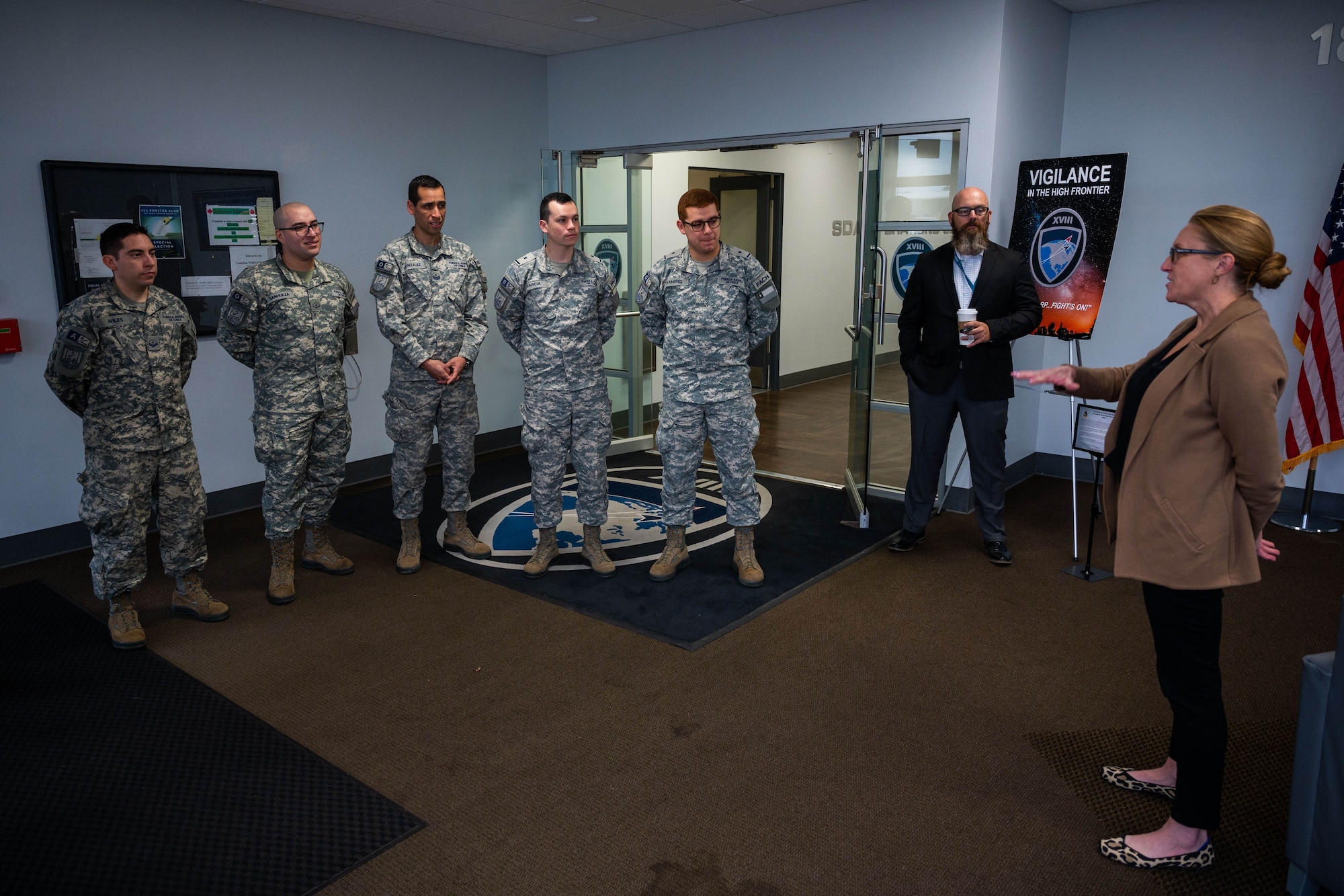 Diana McKissock, Space Delta 2’s Space Domain Awareness Partnership and Coalition Engagement office lead, right, greets members of the Chilean Air Force at the 18 Space Defense Squadron on Vandenberg Space Force Base, Calif., Sept. 13, 2023. The Combined Force Space Component Command hosted a delegation from partner nation Chile with discussions focused on SDA, aiming to increase the understanding and benefits of existing Space Situational Awareness sharing agreements, interoperability, and integration. (U.S. Space Force photo by Tech. Sgt. Luke Kitterman)