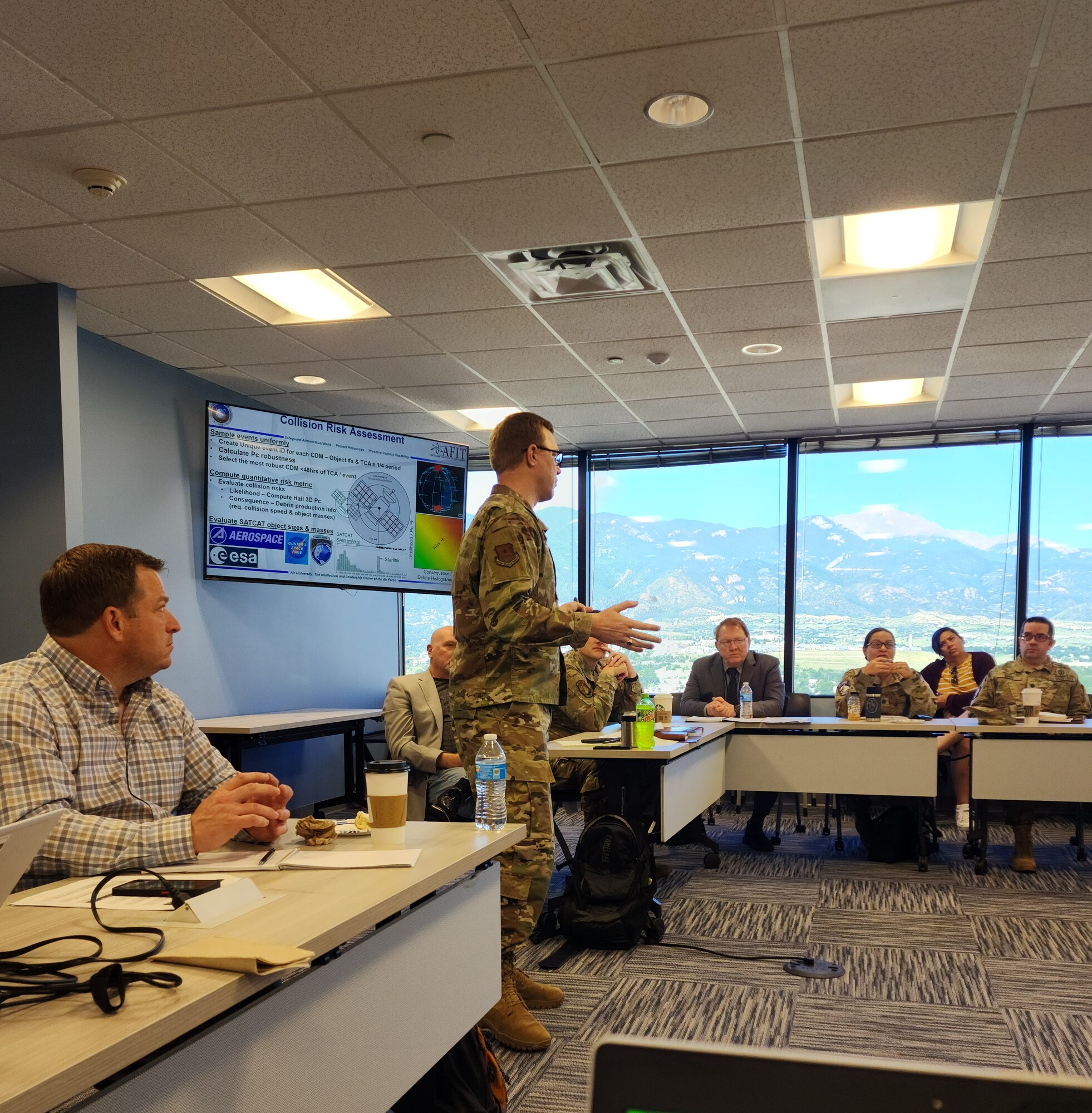 Lt. Col. Daniel Moomey, Operations Branch chief, provides an update on his doctoral work titled “the Conjunction Assessment Safety Program.” CASP is the space equivalent to aviation’s Bird/Wildlife Aircraft Strike Hazard program. (Courtesy Photo)