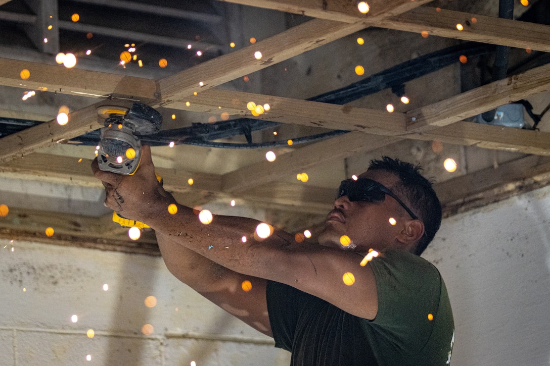 U.S. Marine Corps Pfc. Alexiander Sigrah, a native of Kosrae, Federated States of Micronesia and a motor transport technician with Task Force Koa Moana 23, utilizes a grinder during a renovation project at the Dr. Arthur P. Sigrah Memorial Hospital on Tofol, Kosrae, FSM, Sept. 5, 2023. Task Force Koa Moana 23, composed of U.S. Marines and Sailors from I Marine Expeditionary Force, deployed to the Indo-Pacific to strengthen relationships with Pacific Island partners through bilateral and multilateral security cooperation and community engagements. (U.S. Marine Corps photo by Cpl. Trent A. Henry)