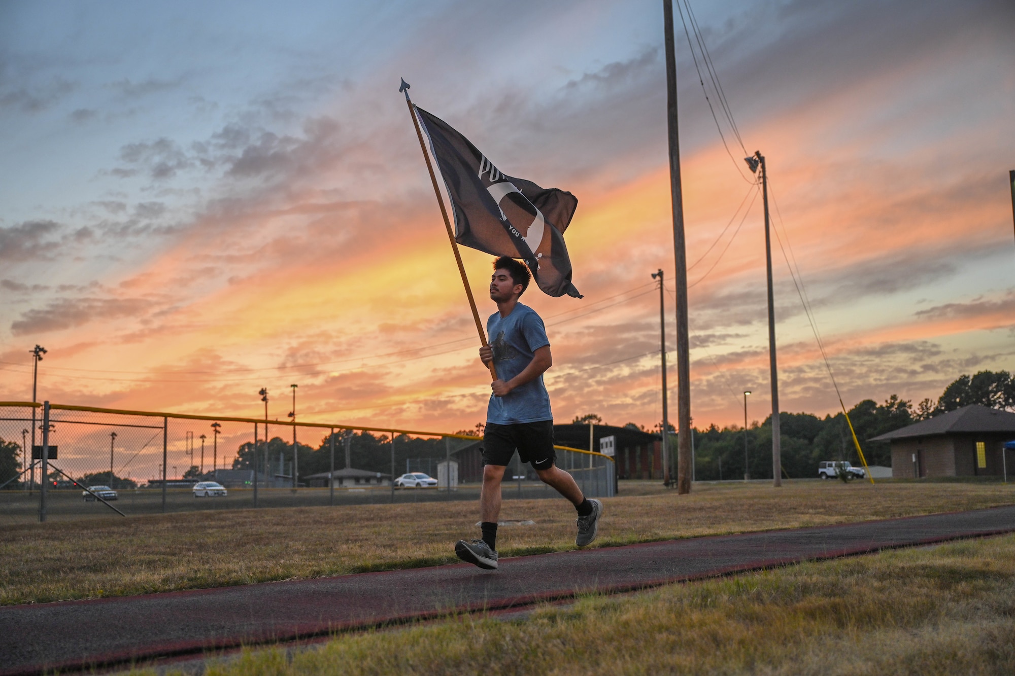 An Airman runs on a track.