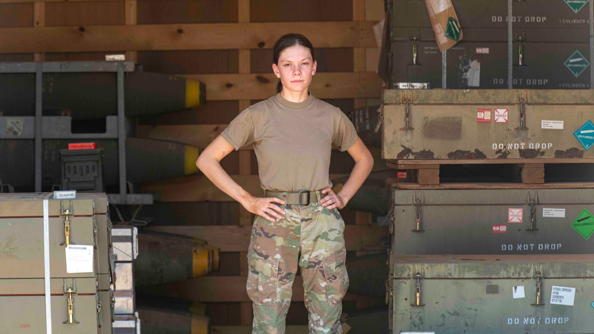 Photo of a woman standing with her hands on her hips