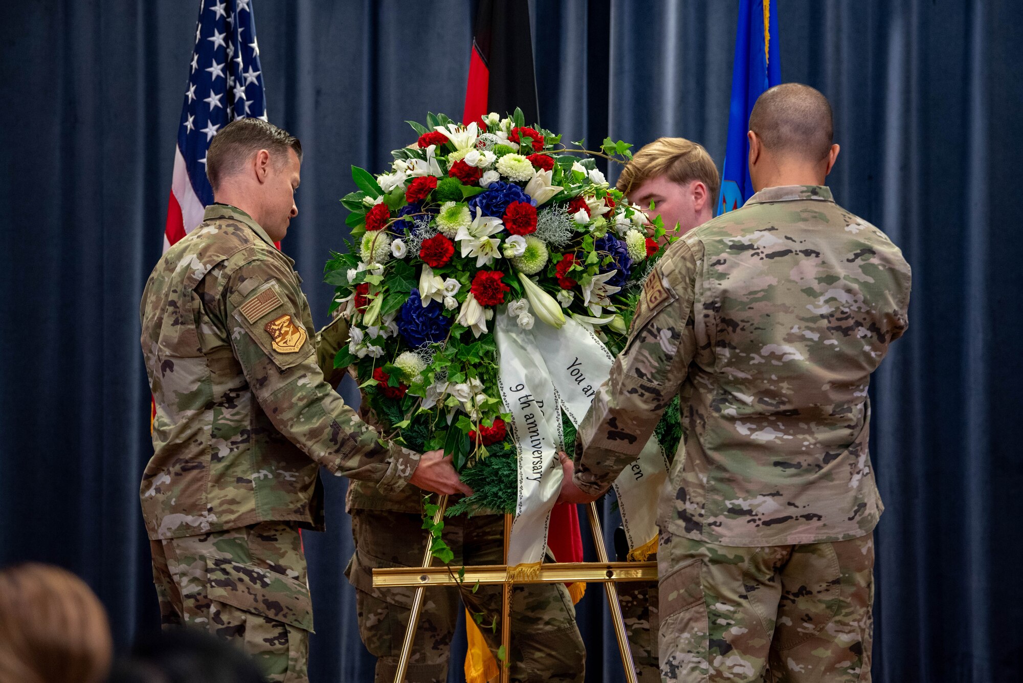 U.S. Air Force Col. Ryan Ley, 52nd Fighter Wing deputy commander (left), and Master Sgt. Ryan Hines, 86th Logistics Readiness Group fuels management flight section chief (right), lay a memorial wreath during a POW/MIA Remembrance Day ceremony