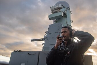 FC2 Lucas M. Ribeiro stands watch during a live-fire exercise board USS Boxer (LHD 4)