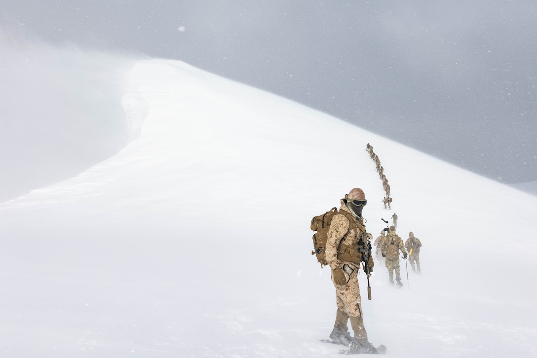 U.S. Marines with 1st Battalion, 4th Marine Regiment, 1st Marine Division, and members of the Chilean naval infantry climb Mount Tarn for the culminating event of a bilateral cold weather training exercise near Punta Arenas, Chile, Aug. 23, 2023. Throughout the exercise, Marines learned proper techniques for obtaining food and water, employed different weapons and gear, built shelters, practiced foot movements over snow, and conducted cold weather personnel rescue. Training exchanges in South America provide U.S. forces opportunities to train in exotic environments such as humid jungles, frigid mountains, and complex waterways while strengthening partnership and enhancing overall interoperability with regional partners.