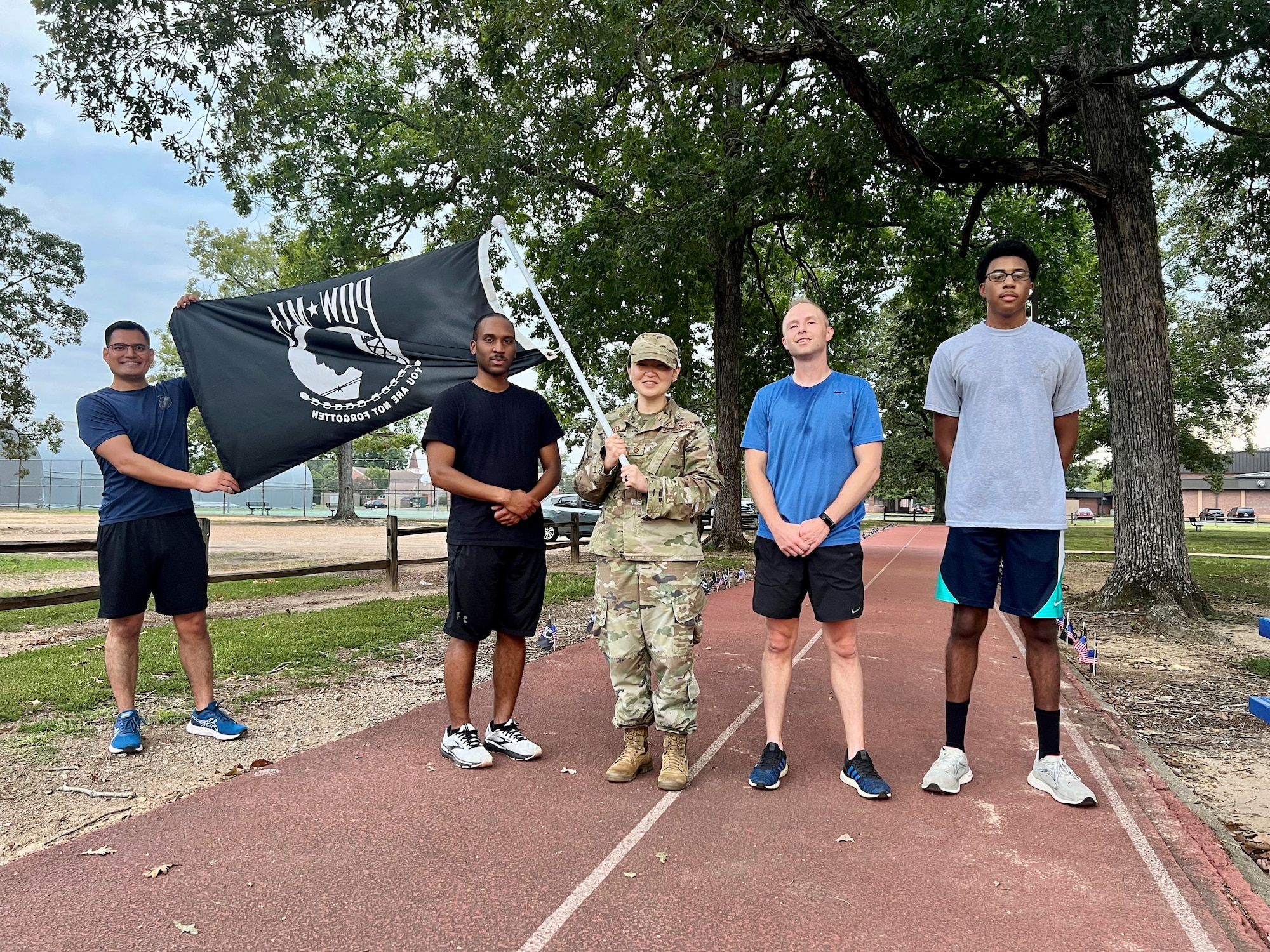 Volunteers keep the POW MIA flag flying during remembrance run.