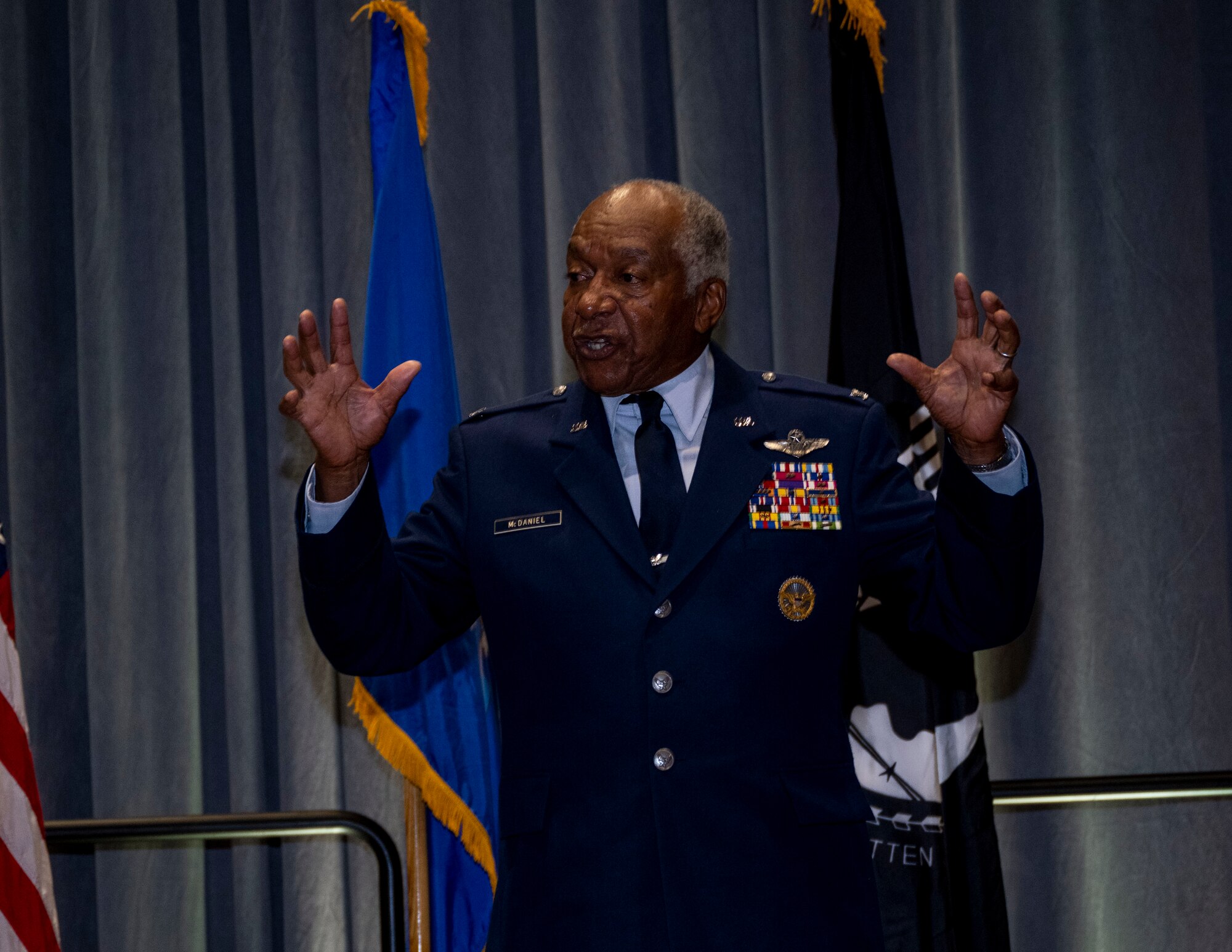 Col. Norman McDaniel, retired Vietnam War veteran, speaks to Airmen during the Air Force ball in Goldsboro, North Carolina, Sep. 16, 2023. McDaniel was chosen as the guest speaker to match the year’s theme which was focused on the 50th anniversary of the end of the Vietnam War. (U.S. Air Force photo by Senior Airman David Lynn)