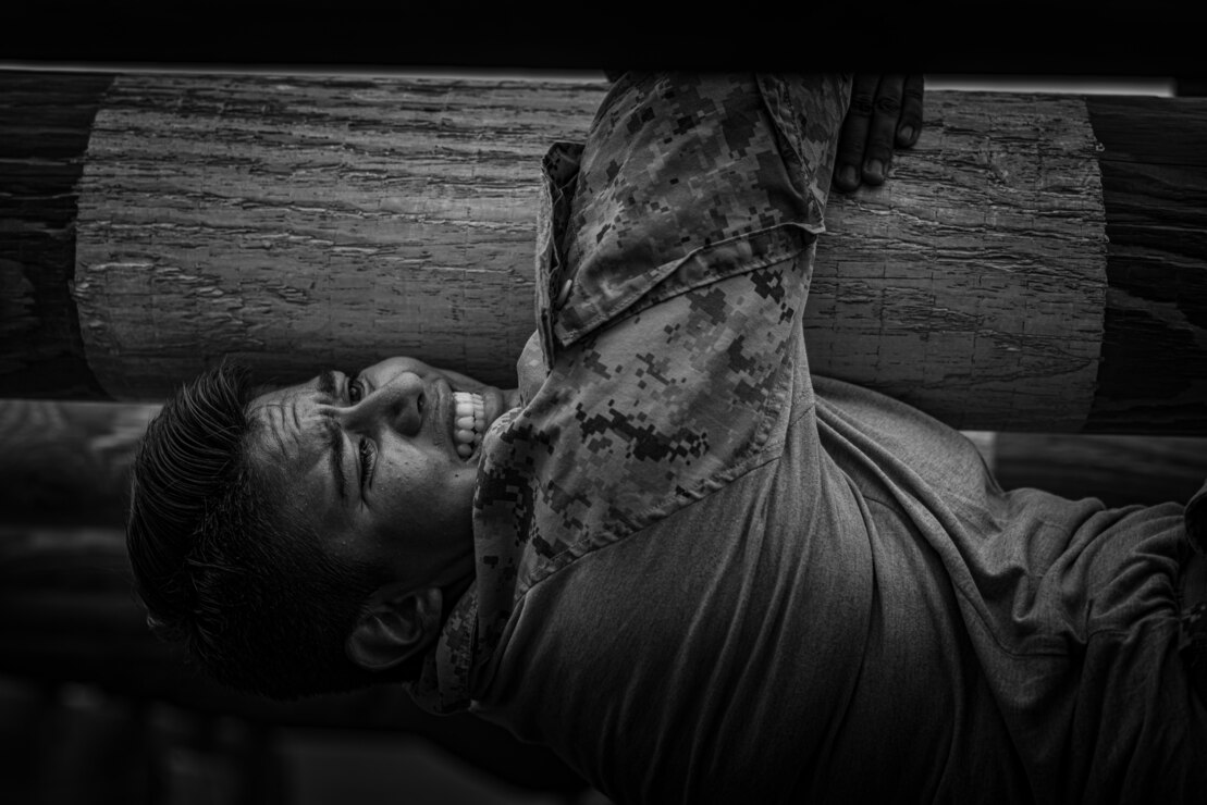 U.S. Marine Corps recruit Ximena Cordova, with Golf Company, 2nd Recruit Training Battalion, navigates a log obstacle during a confidence course event at Marine Corps Recruit Depot San Diego, Sept. 18, 2023.