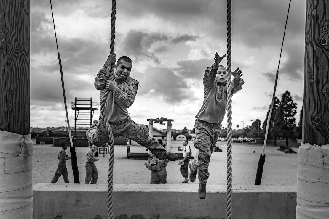 U.S. Marine Corps recruits with Golf Company, 2nd Recruit Training Battalion, jump through a rope obstacle during a confidence course event at Marine Corps Recruit Depot San Diego, Sept. 18, 2023.