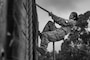 A U.S. Marine Corps recruit with Golf Company, 2nd Recruit Training Battalion, navigates a wall climb obstacle during a confidence course event at Marine Corps Recruit Depot San Diego, Sept. 18, 2023. Recruits became physically and mentally stronger by overcoming obstacles that require strength, balance, and determination. (U.S. Marine Corps photo by Cpl. Alexander O. Devereux)