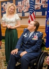 Lt. Col. (ret.) Dana Duerr, who recently served as Senior Program Manager of the Nurse Corps Education and Training at Air Force Medical Readiness Agency, and her daughter, Mikaela, share an expression of love during Duerr’s retirement ceremony in the Gateway Club at Joint Base San Antonio-Lackland, Texas, Aug. 30, 2023. When Mikaela was growing up, she used to help her mother prepare mannequins that were used to train medics. (U.S. Air Force photo by Senior Airman Melody Bordeaux)