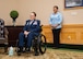 Lt. Col. (ret.) Dana Duerr, who recently served as Senior Program Manager of the Nurse Corps Education and Training Program at Air Force Medical Readiness Agency, sits in her wheelchair during her retirement ceremony in the Gateway Club at Joint Base San Antonio-Lackland, Texas, Aug. 30, 2023. Duerr was honored as an outstanding flight nurse, educator and warrior throughout her career of over 29 years. (U.S. Air Force photo by Senior Airman Melody Bordeaux)