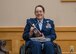 Lt. Col. (ret.) Dana Duerr, who recently served as Senior Program Manager of the Nurse Corps Education and Training Program at Air Force Medical Readiness Agency, is presented a cowbell featuring the 595th Medical Group commander’s coin during her retirement ceremony in the Gateway Club at Joint Base San Antonio-Lackland, Texas, Aug. 30, 2023. Col. John Davis, 959th MDG commander and presiding officer over the ceremony, gifted the cowbells to Duerr and Mikaela as a symbol that their care for others was instrumental in making a difference. (U.S. Air Force photo by Senior Airman Melody Bordeaux)