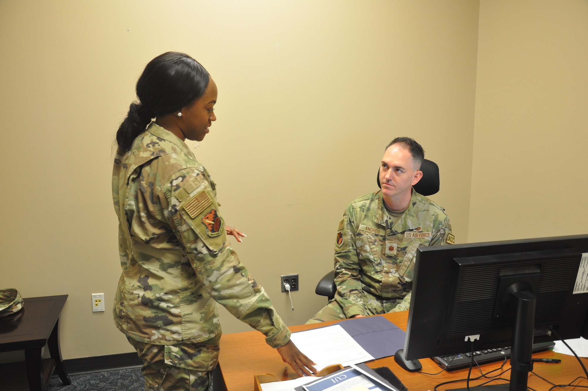 a woman briefs a man on legal issues