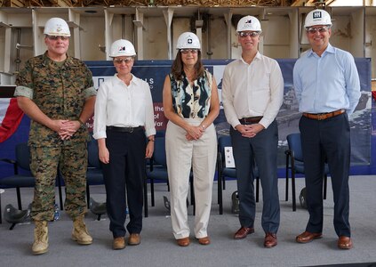 The keel laying and authentication ceremony for the future USS Fallujah (LHA 9) was held at the Huntington Ingalls Industries (HII) Pascagoula shipyard, Sept. 20. In attendance and pictured from left: Maj. Gen. David Bligh, Staff Judge Advocate to the Commandant of the Marine Corps; Kari Wilkinson, President, Ingalls Shipbuilding and Executive Vice President, HII; Donna Berger, Ship Sponsor; the Honorable Erik Raven, Under Secretary of the Navy; and Chris Kastner, President and Chief Executive Officer, HII.