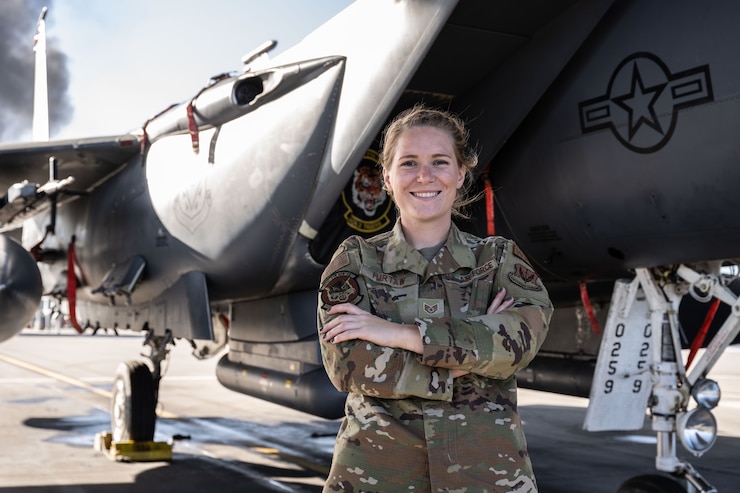 Photo of Airman in front of F-15E Strike Eagle