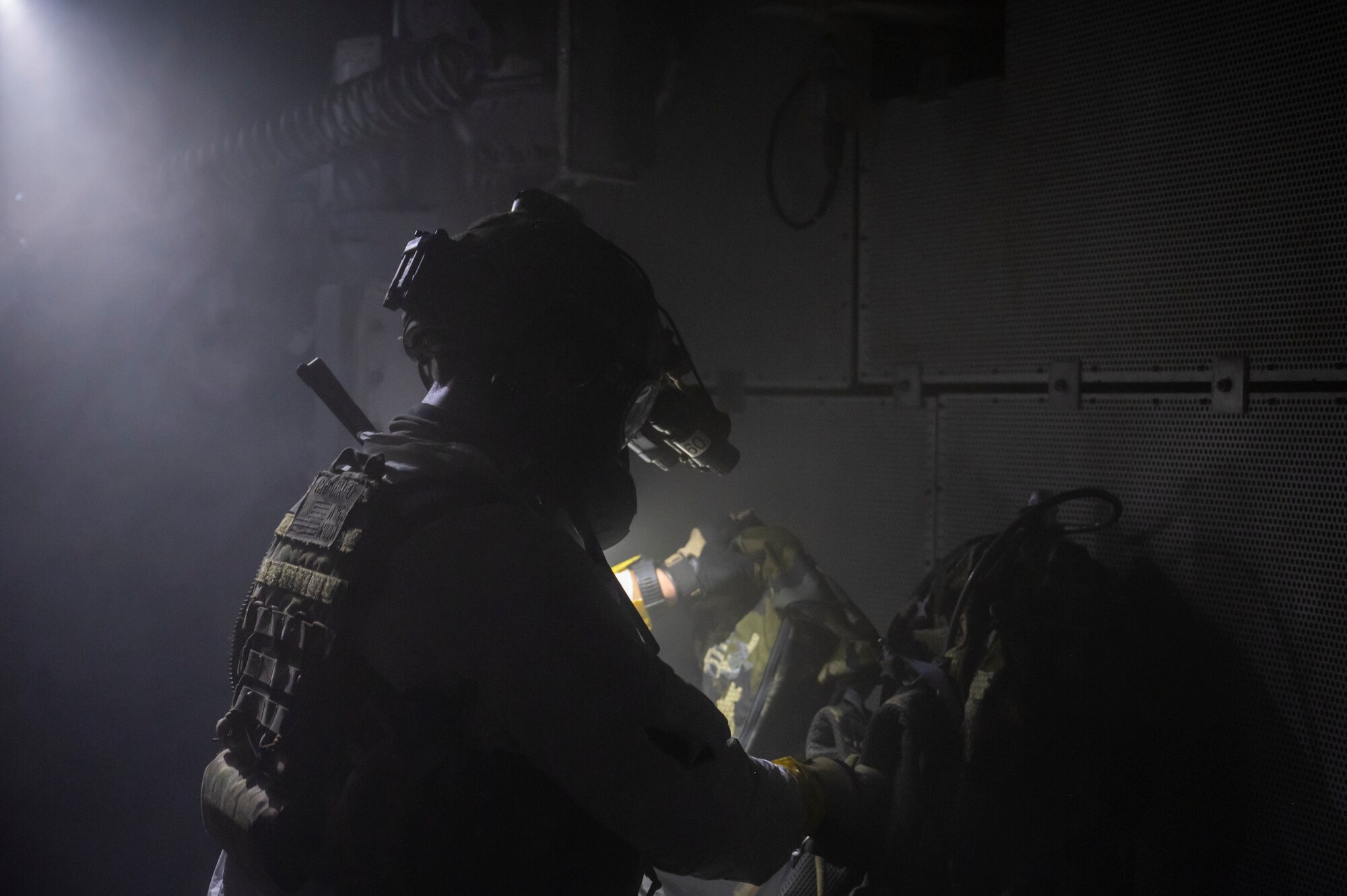 A photo of U.S. Airman, training with the 68th Rescue Squadron, checks oxygen levels during a Combat Leader Course training exercise at the Titan Missile Museum.