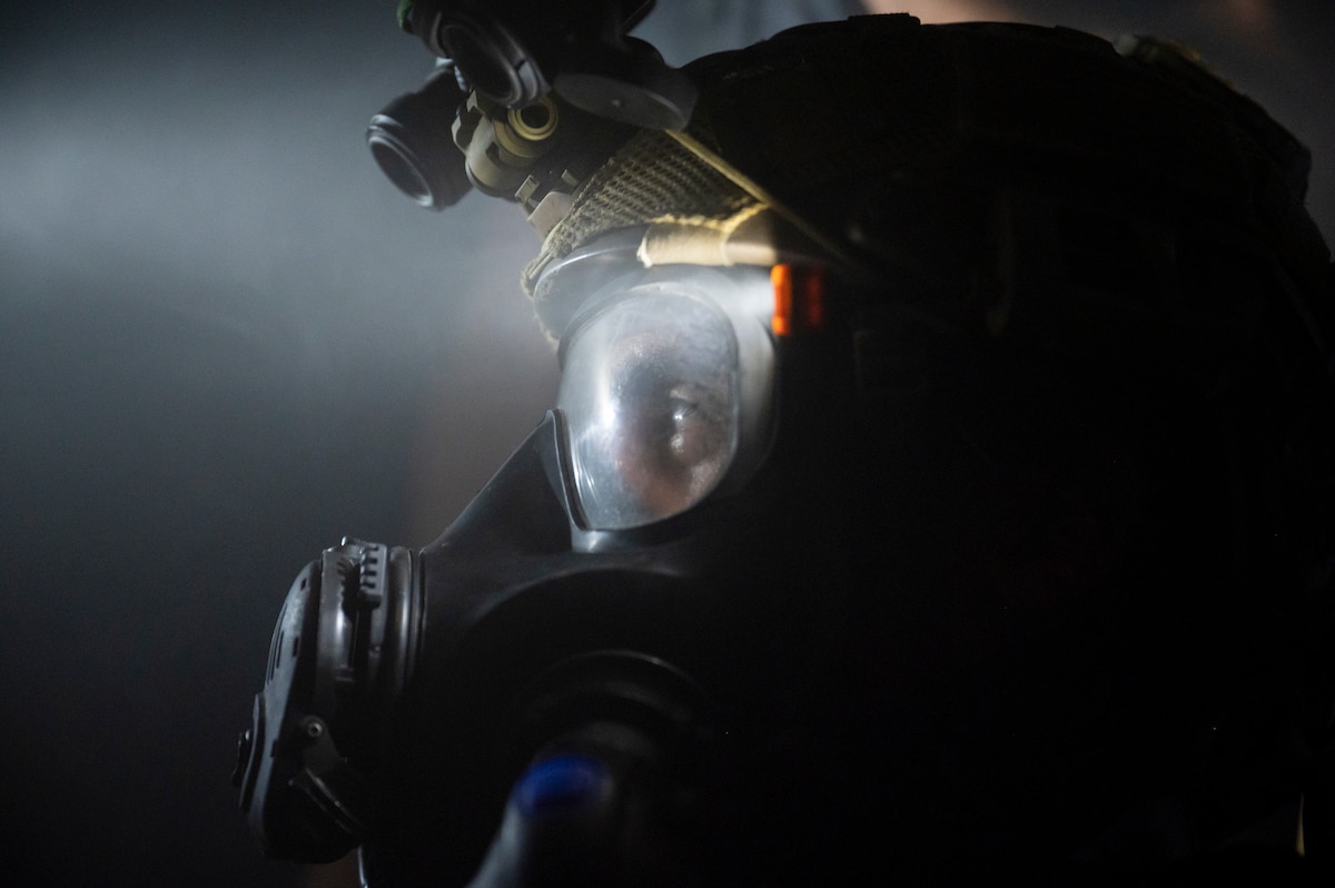 A photo of U.S. Airman, training with the 68th Rescue Squadron, discusses a plan to rescue simulated casualties during a Combat Leader Course training exercise at the Titan Missile Museum.