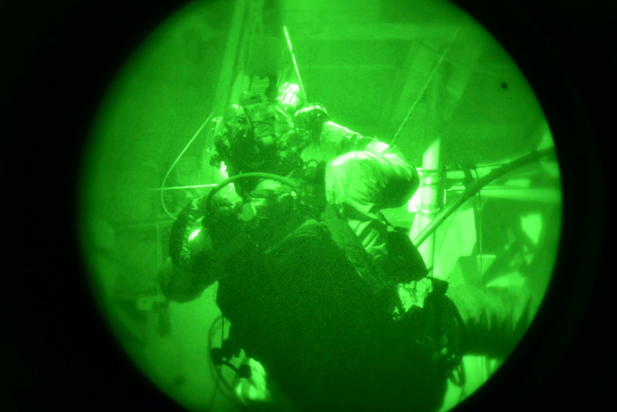 A photo of a U.S. Airman, training with the 68th Rescue Squadron, rappels down the Titan Missile Museum.