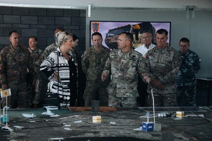 The 8th Theater Sustainment Command Commander Maj. Gen. Jered Helwig, highlights key points of the Joint Logistics Over-the-Shore operation to the Secretary of the Army Christine Wormuth and other senior leaders during Talisman Sabre 2023 in Bowen, Australia, July 31, 2023. JLOTS demonstrates the critical capability of bringing vehicles and equipment to the shore in austere environments or when port facilities are unavailable. Talisman Sabre is the largest bilateral military exercise between Australia and the United States, with multinational participation, advancing a free and open Indo-Pacific by strengthening relationships and interoperability among key allies and enhancing our collective capabilities to respond to a wide array of potential security concerns.
