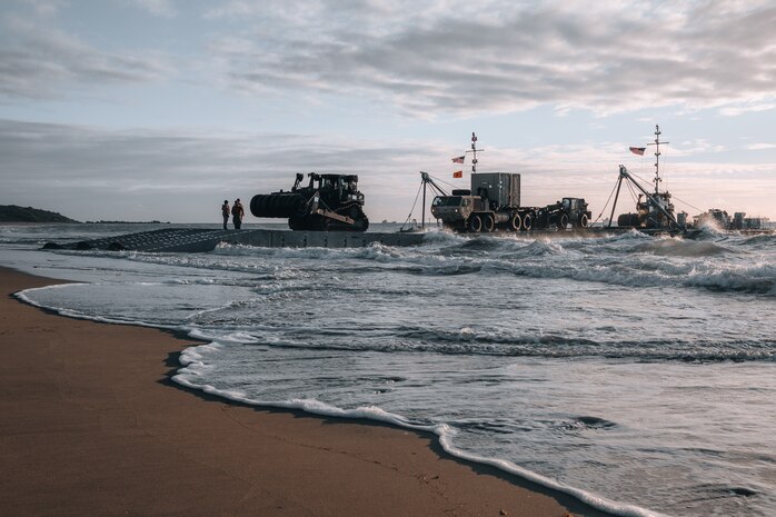 Army mariners discharge vehicles on the beach via the causeway ferry as part of the Joint Logistics Over-the-Shore operation during Talisman Sabre 2023 in Bowen, Australia, July 31, 2023. JLOTS demonstrates the critical capability of bringing vehicles and equipment to the shore in austere environments or when port facilities are unavailable. Talisman Sabre is the largest bilateral military exercise between Australia and the United States, with multinational participation, advancing a free and open Indo-Pacific by strengthening relationships and interoperability among key allies and enhancing our collective capabilities to respond to a wide array of potential security concerns.