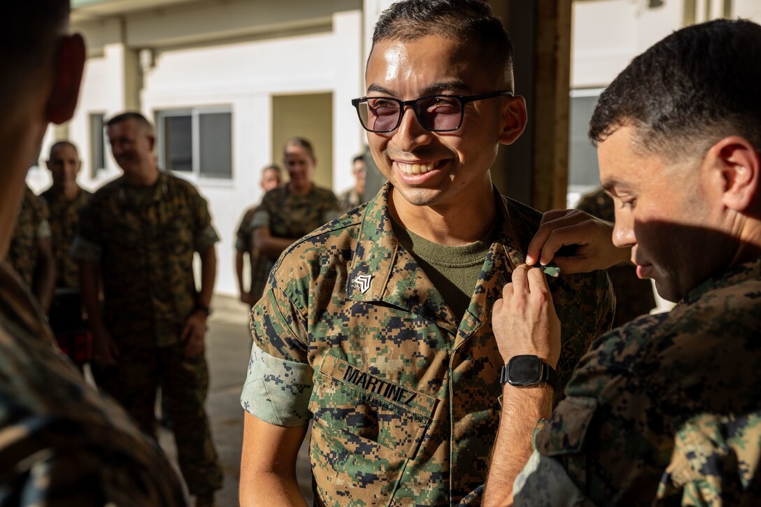 U.S. Marine Corps Sgt. Isaac Martinez, a legal service specialist with Marine Wing Headquarters Squadron (MWHS-1) 1, 1st Marine Aircraft Wing (MAW), is pinned during a meritorious promotion to the rank of sergeant at Marine Corps Air Station Futenma, Japan, Sept. 12, 2023. The 36th Assistant Commandant of the Marine Corps and the 20th Sergeant Major of the Marine Corps met with Marines from across the MAW and personally recognized them for their hard work, discipline, and motivation. (Courtesy Photo)