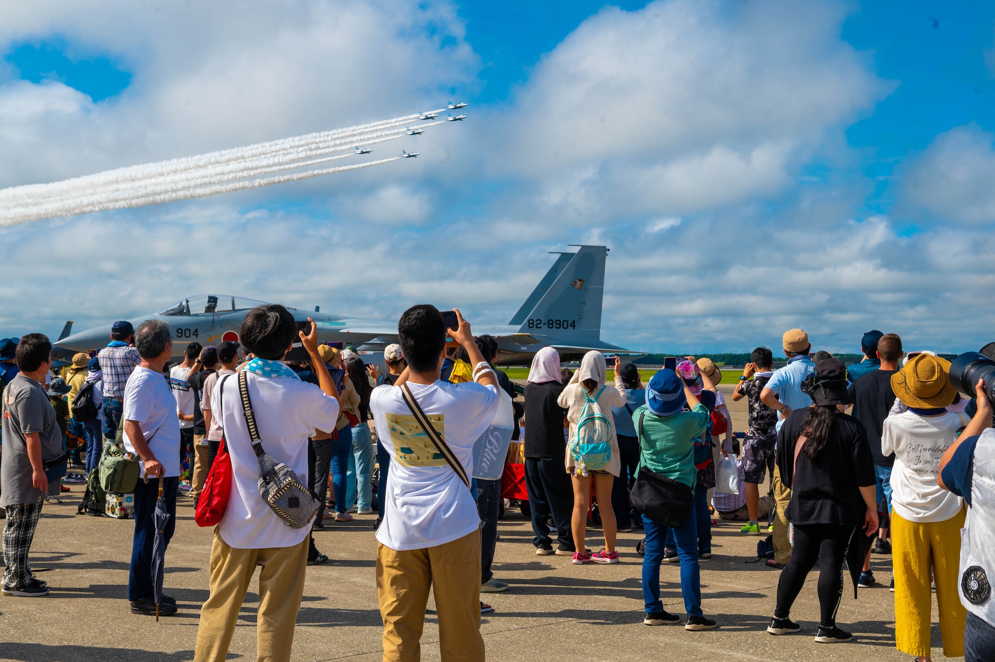 Attendees watch a flyover during Misawa Air Fest 2023.