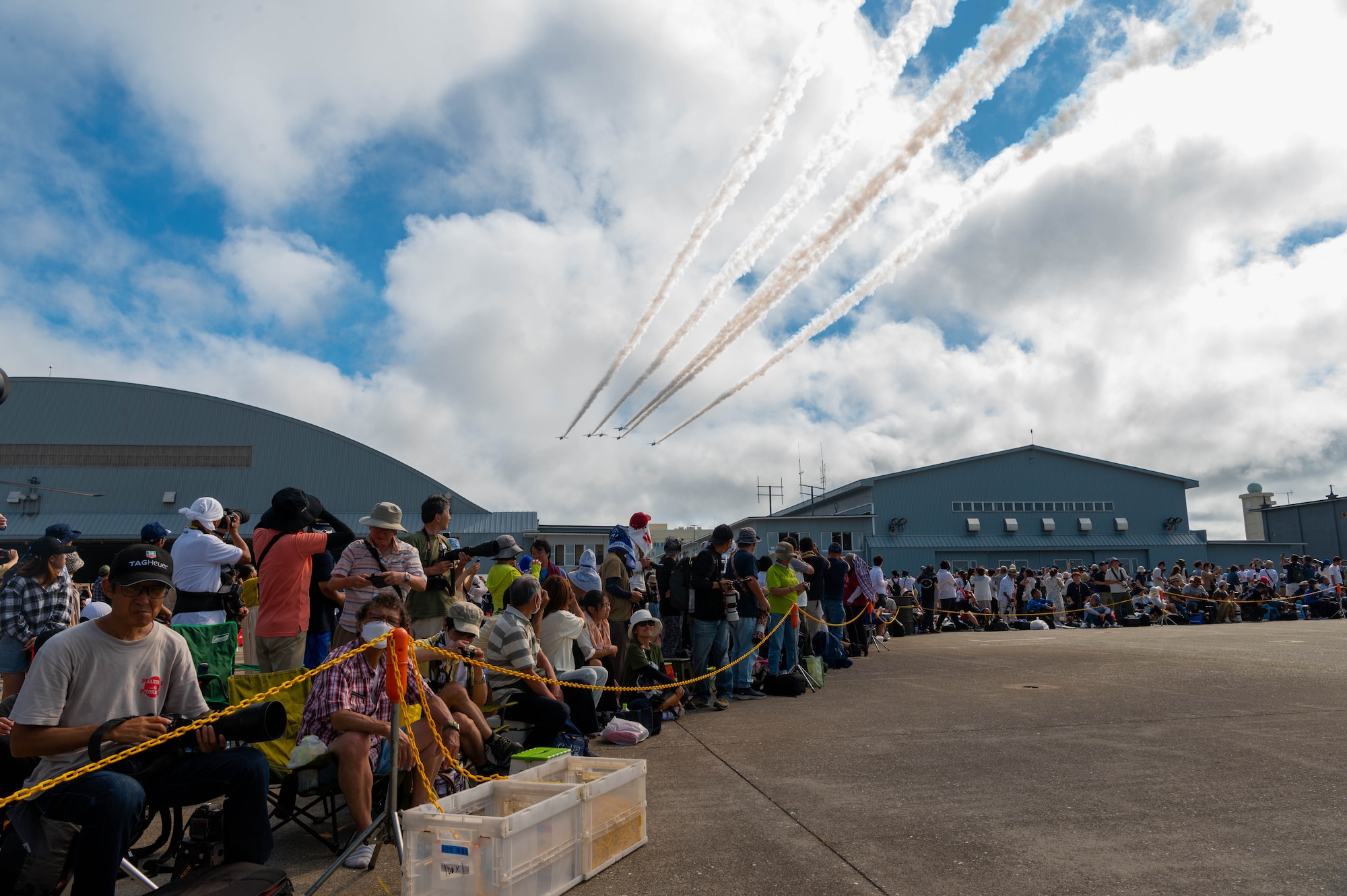 Attendees watch a flyover by jets during Misawa Air Fest 2023