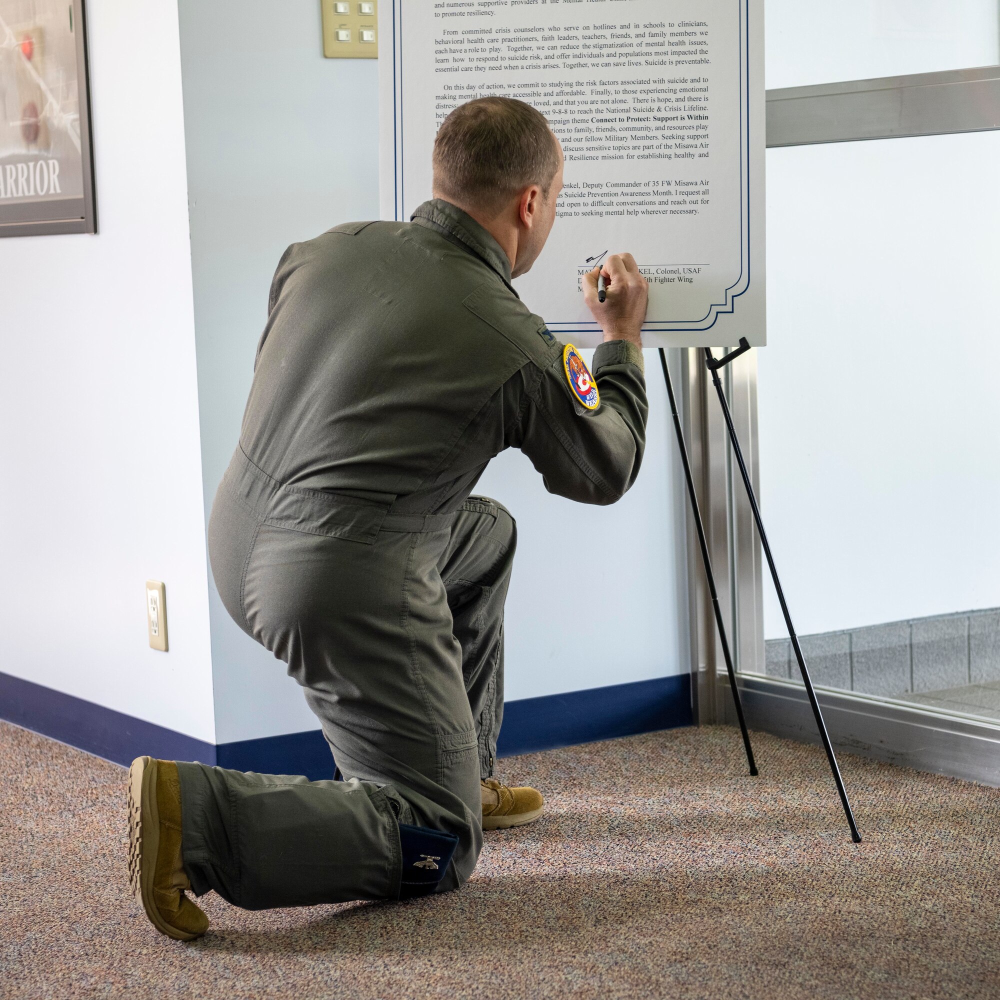 U.S. Air Force Col. Matthew Kenkel, 35th Fighter Wing deputy commander, signs Misawa’s 2023 Suicide Prevention Proclamation at Misawa Air Base, Japan.