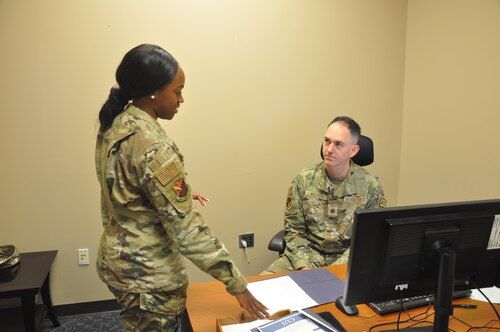 a woman briefs a man on legal issues