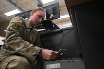 Airman 1st Class Alily Kliewer, 28th Logistics Readiness Squadron light ground vehicle fleet management and analysis technician, files a work order receipt, Sept. 8, 2023, at Ellsworth Air Force Base, South Dakota.