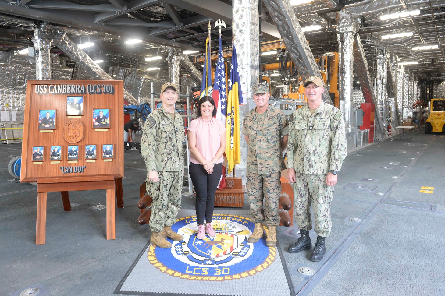 Natasha Fyles, center left, the Australian Chief Minister of Northern Territory, poses for a photo alongside leadership aboard the Independence-variant littoral combat ship USS Canberra (LCS 30) during a scheduled tour, Sept. 11, 2023.