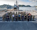 Senior leadership from Australia, Canada, Japan, New Zealand, the United Kingdom and the United States defense services pose for a photo aboard USS Blue Ridge (LCC-19), for the 2023 Information Warfare (IW) Waterfront Conference hosted by U.S. 7th Fleet, in Yokosuka, Japan, Sept. 11-15. U.S. 7th Fleet is the U.S. Navy's largest forward-deployed numbered fleet, and routinely interacts and operates with allies and partners in preserving a free and open Indo-Pacific region.