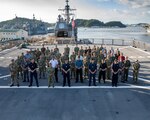 Senior leadership from Australia, Canada, Japan, New Zealand, the United Kingdom and the United States defense services pose for a photo aboard USS Blue Ridge (LCC-19), for the 2023 Information Warfare (IW) Waterfront Conference hosted by U.S. 7th Fleet, in Yokosuka, Japan, Sept. 11-15. U.S. 7th Fleet is the U.S. Navy's largest forward-deployed numbered fleet, and routinely interacts and operates with allies and partners in preserving a free and open Indo-Pacific region.