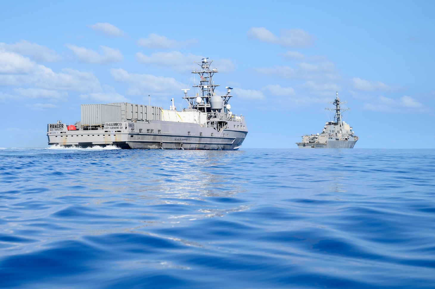 The unmanned surface vessel Ranger trails the Arleigh Burke-class guided-missile destroyer USS Shoup (DDG 86) as both ships transit the Pacific Ocean during Integrated Battle Problem (IBP) 23.2, Sep. 15, 2023. IBP 23.2 is a Pacific Fleet exercise to test, develop and evaluate the integration of unmanned platforms into fleet operations to create warfighting advantages. (U.S. Navy photo by Mass Communication Specialist 2nd Class Jesse Monford)