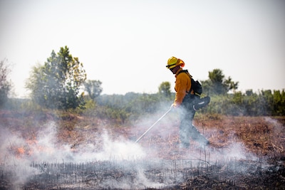 An Oklahoma Army National Guard Soldier constructs a firebreak at the Wildland Firefighting Course at Camp Gruber Training Center, Oklahoma, Aug. 21, 2023. Soldiers volunteered for the course to earn their Red Card Certification and have the knowledge and experience to respond to wildfire incidents both in state and around the nation. (Oklahoma Army National Guard photo by Spc. Danielle Rayon)