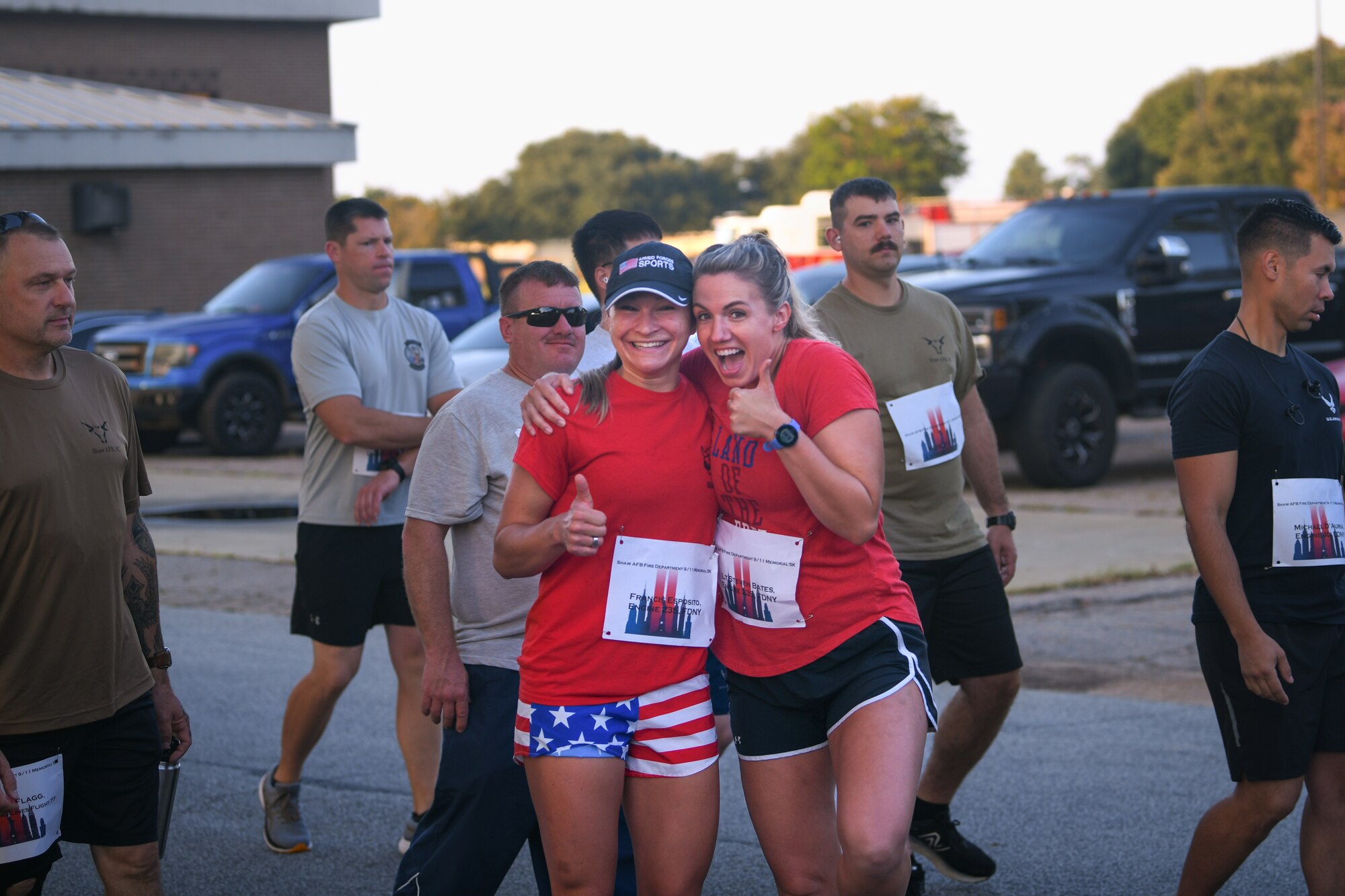 Two participants smiles at the camera as they were walking to the starting point of the 5k.