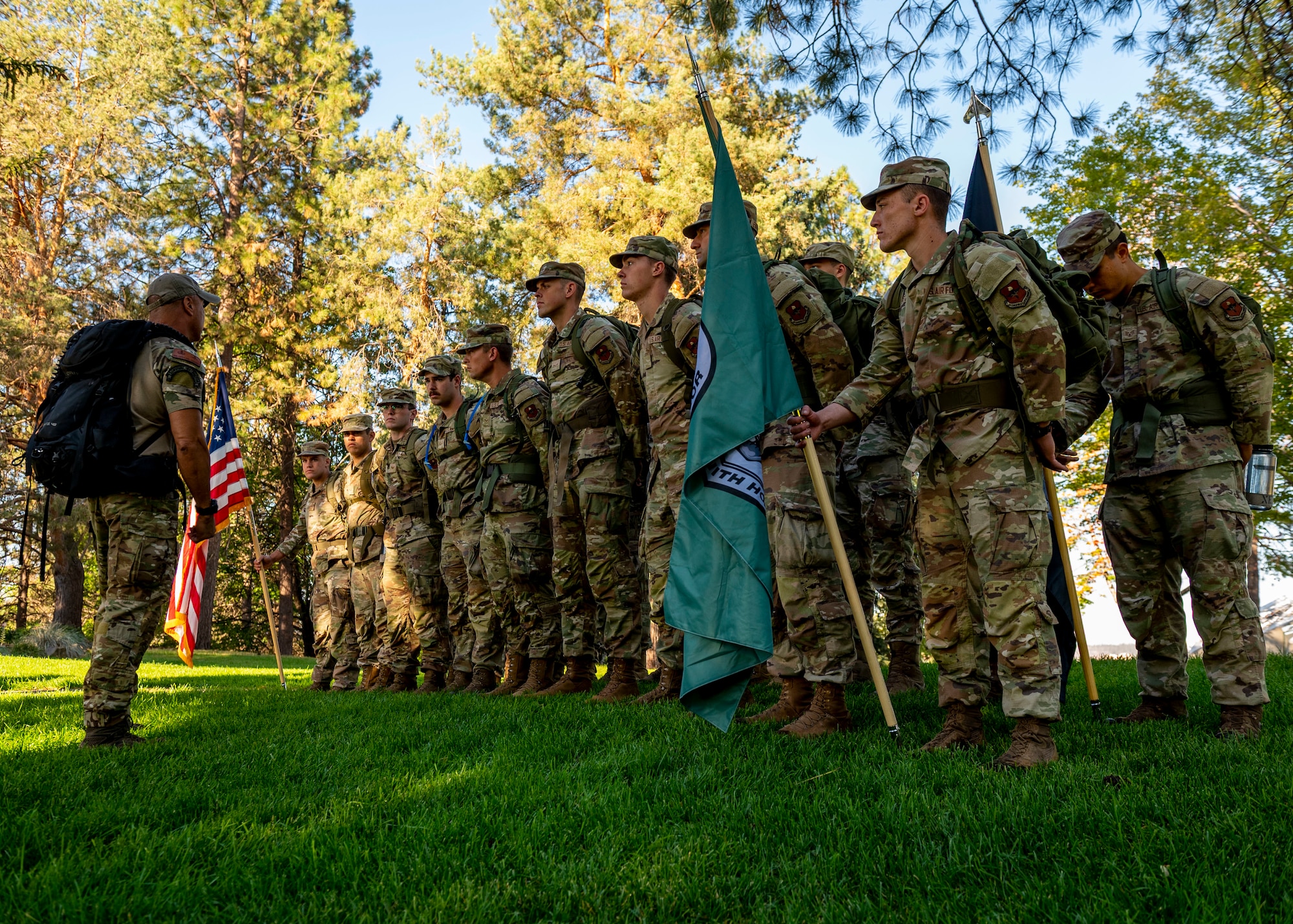 Del Rosario, a survival, evasion, resistance and escape candidate course instructor assigned to the 66th Training Squadron, briefs a formation of SERE candidates before a 24-hour ruck march at Riverfront Park in Spokane, Washington, Sept. 14, 2023. Airmen from the 336th Training Group at Fairchild Air Force Base gathered around the Vietnam Veteran’s Memorial before starting a 24-hour ruck march. During the ruck march, Airmen from Fairchild Air Force Base kept the Prisoner of War/Missing in Action flag in constant motion to honor National POW/MIA Recognition Day. The march began on Sept. 14 at the Vietnam Veterans Memorial in downtown Spokane and continued through Airway Heights before concluding at Fairchild AFB. The event culminated with a recognition ceremony on Sept. 15 to honor all American prisoners of war and those Americans still missing in action, as well as their families. Every year, the third Friday in September is recognized in the United States as National POW/MIA Recognition Day. The Department of Defense is steadfast in its commitment to finding, recovering, identifying and repatriating the remains of its heroes who are unaccounted for. (U.S. Air Force photo by Staff Sgt. Lawrence Sena)