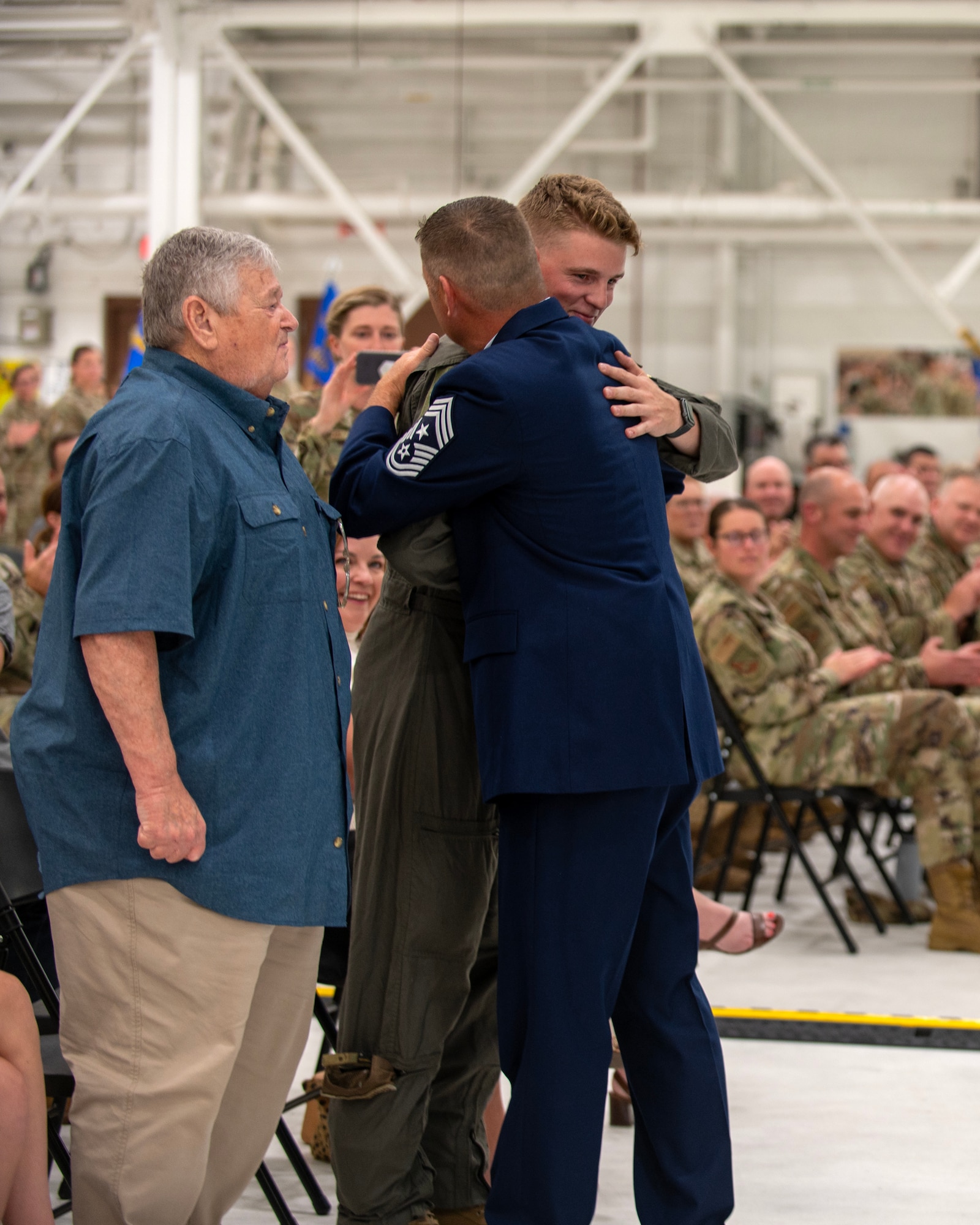 U.S. Air Force Airmen from the 133rd Airlift Wing, along with friends and family of U.S. Air Force Chief Master Sgt. Mark Legvold and Richard Schumacher, gather for a change of responsibility ceremony in St. Paul, Minn., Sept. 9, 2023.