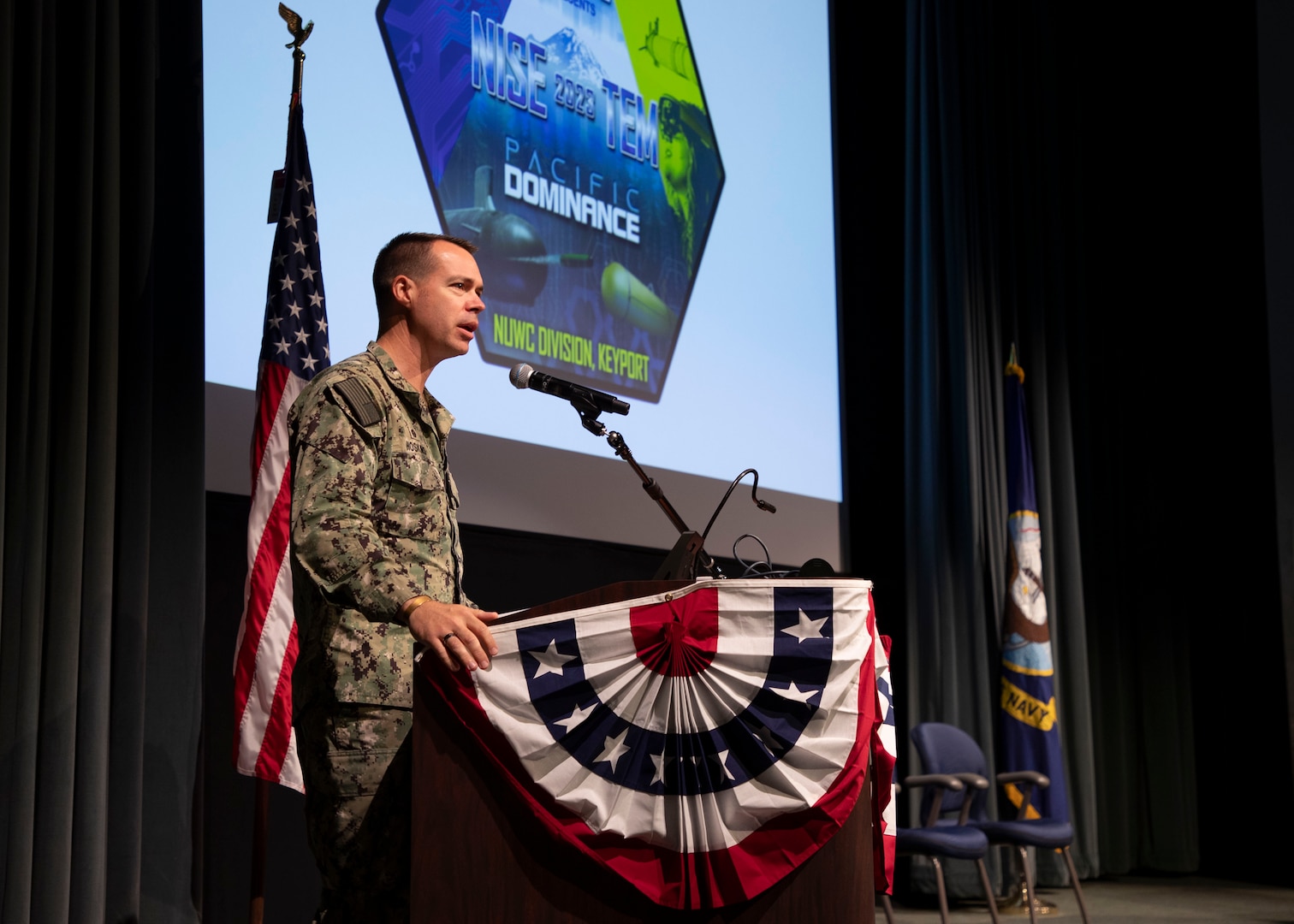 Naval Undersea Warfare Center Division, Keyport Commanding Officer Capt. Clint Hoskins speaks during this year's Naval Innovative Science and Engineering Technical Exchange Meeting, held at NUWC Division, Keyport, Sept. 12-14. This has been a year of firsts for the NISE TEM.