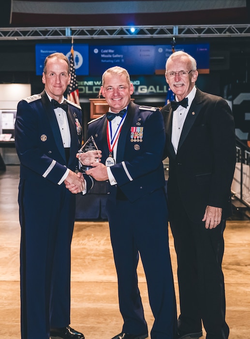 An award winner poses for a photo during the Air Force Ball