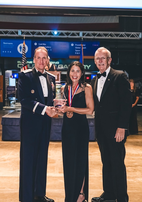 An award winner poses for a photo during the Air Force Ball