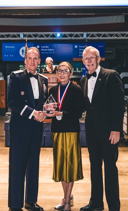 An award winner poses for a photo during the Air Force Ball