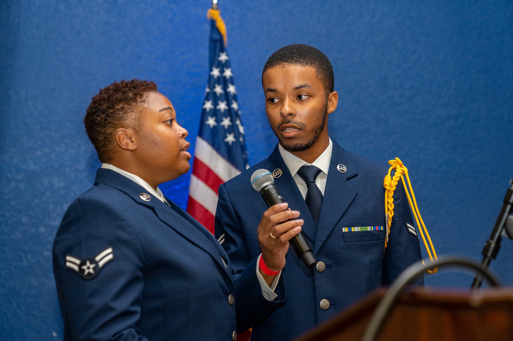 U.S. Air Force Airman 1st Class Josiah Forbes Hart and Airman 1st Class Genesis Mason, 338th Training Squadron cyber network students, sing the National Anthem during the Airman’s Ball at Keesler Air Force Base, Mississippi, Sept. 14, 2023.