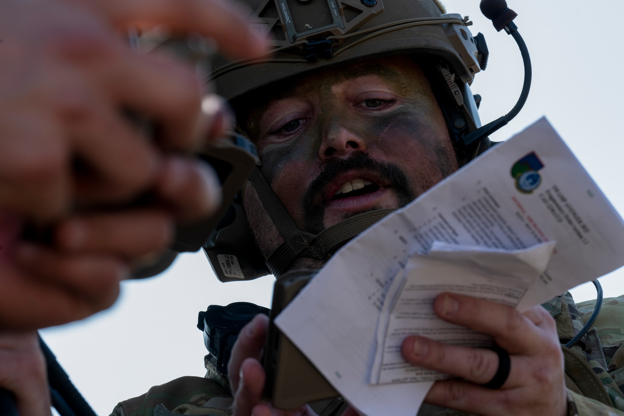U.S. Air Force Staff Sgt. Taylor Beams, a 621st Mobility Support Operations Squadron enlisted air/ground liason element (EAGLE) team member, inputs exercise information into his Android Tactical Awareness Kit (ATAK) during Exercise SWAMP AVENGER at North Field, South Carolina, May 24, 2023. EAGLEs are postured to rapidly deploy to locations all over the world to assist USAF deployed joint partners and other Major Command forces via stragetic airlift. EAGLEs are also trained leaders in their respective air force speciality codes and are expected to bring critical knowledge and experience from their previous assisngments to quickly embed with any joint partner unit. (U.S. Air Force photo by Staff Sgt. Scott Warner)