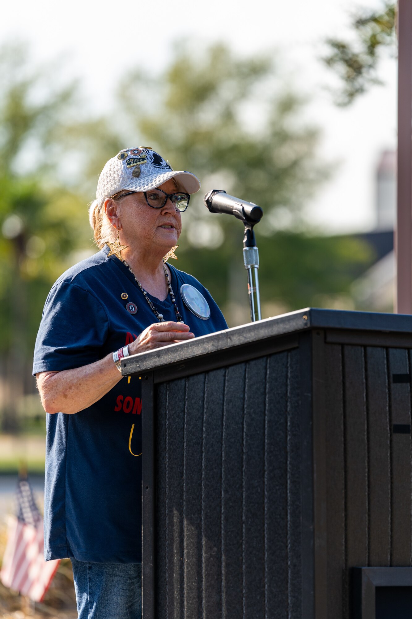 Diane Moore, Gold Star Daughter, speaks to U.S. Airmen and guests during the POW/MIA Retreat Ceremony at Keesler Air Force Base, Mississippi, Sept. 15, 2023.